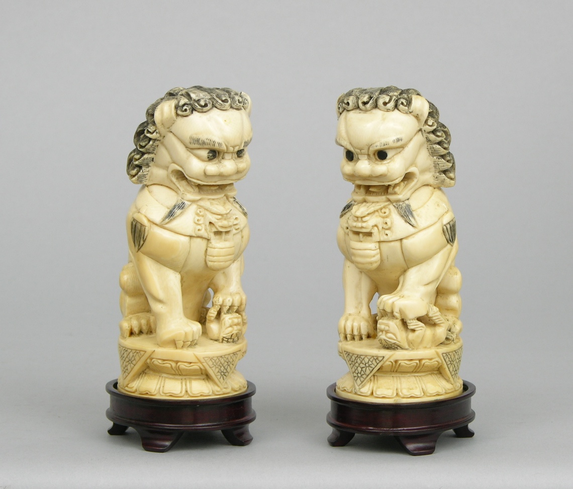 A Pair of Carved Ivory Foo Dogs , 03.01.07