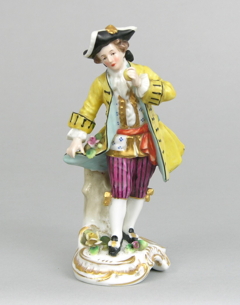 An Unmarked Porcelain Figurine of a Man in a Yellow Coat, 11.22.08