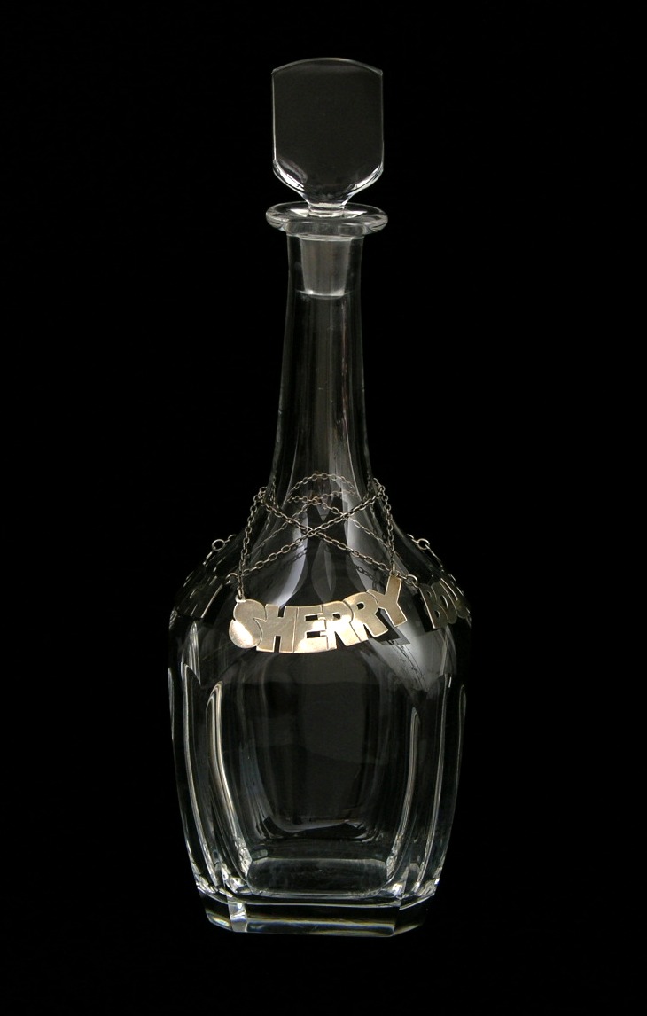 An Orrefors Crystal Decanter with Three Sterling Silver Labels, 03.06.