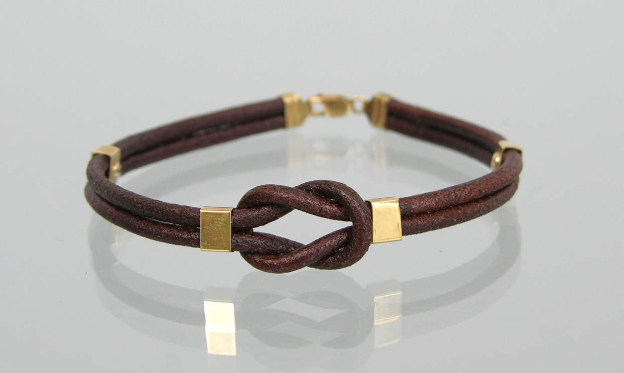 A Leather and 18k Gold Bracelet , 05.15.09, Sold: $207