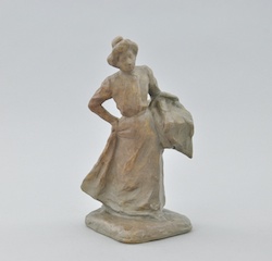 A Mougin Freres Glazed Stoneware Figurine of a Laundress after Emile Wittmann (1846-1921)