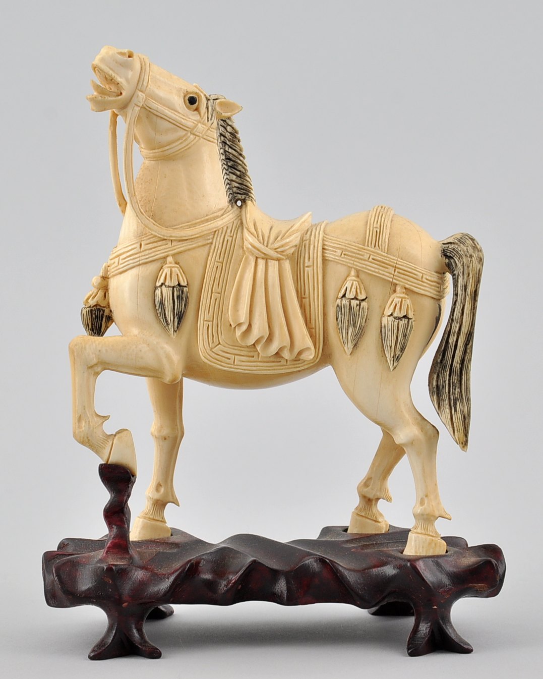 A Chinese Hand Carved Ivory Horse on Fitted Rosewood Stand, 05.22 
