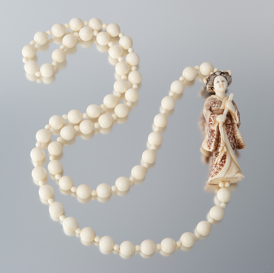 A Carved Ivory Bead Necklace with A Geisha Figure , 11.19.10, Sold 218.5