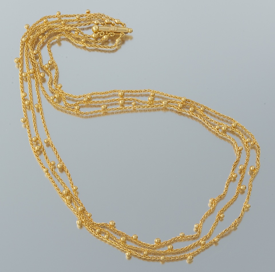 A Ladies' Three Strand Gold Necklace by Unoaerre , 09.24.10, Sold 718.75