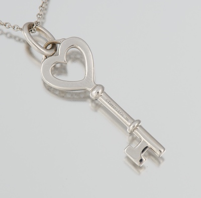 A Tiffany & Co 18k and Diamond Key Pendant on Platinum Tiffany Chain