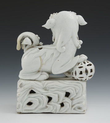 A Chinese Porcelain Blanc-de-Chine Foo Lion, Early Qing, Kangxi Period