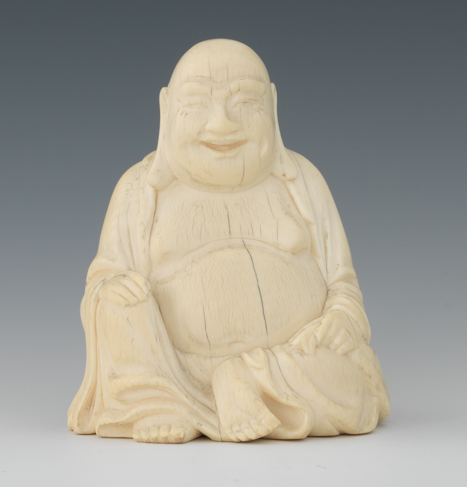 small carved ivory buddha