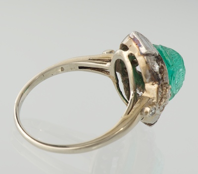 An Art Deco Carved Emerald and Diamond Ring, 05.25.12, Sold: $891.25