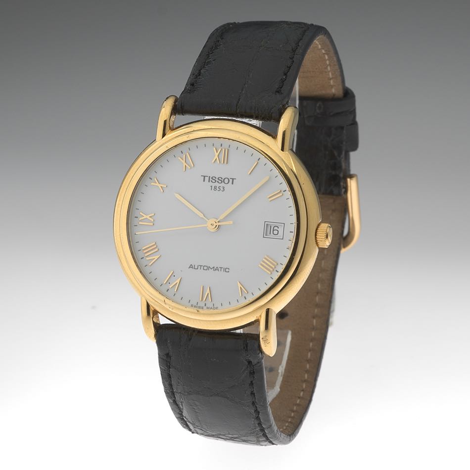 Tissot золотые